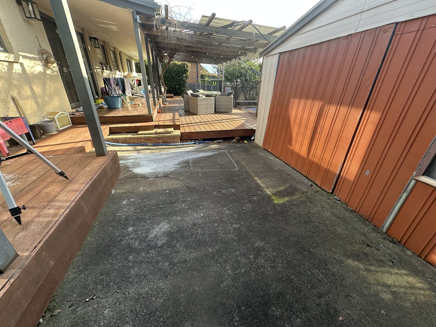 Dirty concrete courtyard before pressure cleaning in Canberra