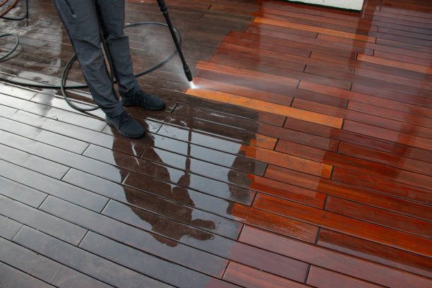 Timber deck being pressure washed back to bare, clean boards
